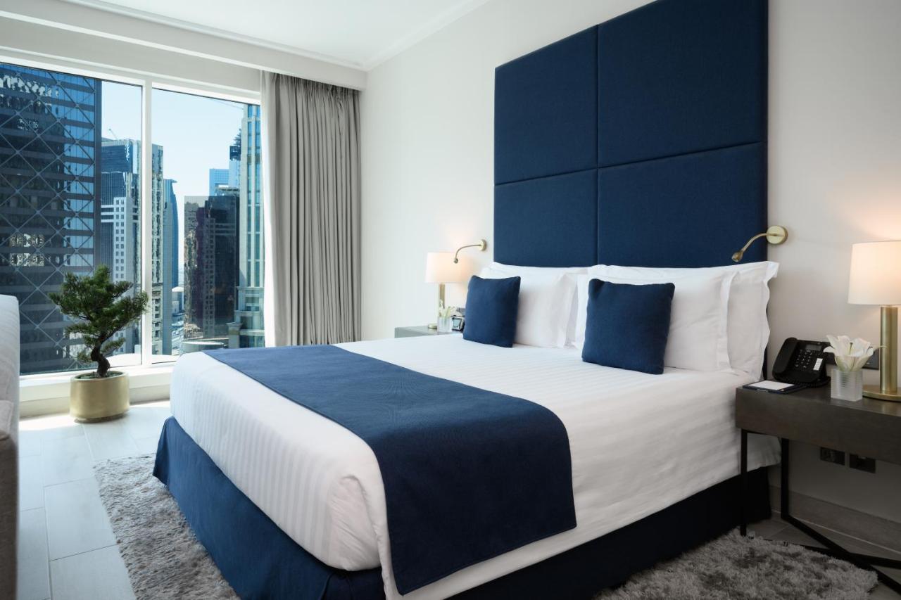 Centara West Bay Hotel & Residences Doha Exteriör bild A bedroom at the hotel