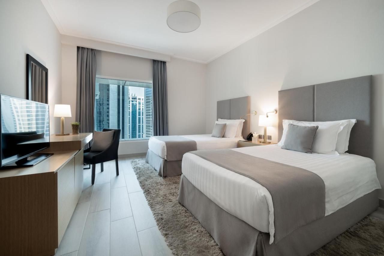 Centara West Bay Hotel & Residences Doha Exteriör bild A typical guest room at the hotel