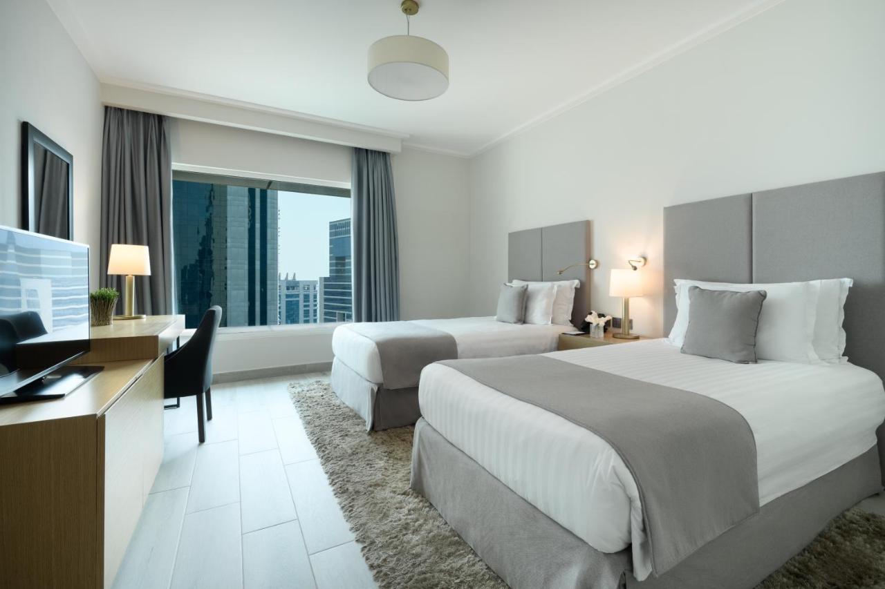 Centara West Bay Hotel & Residences Doha Exteriör bild A guest room at the hotel