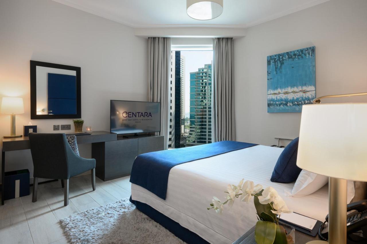 Centara West Bay Hotel & Residences Doha Exteriör bild A bedroom at the hotel