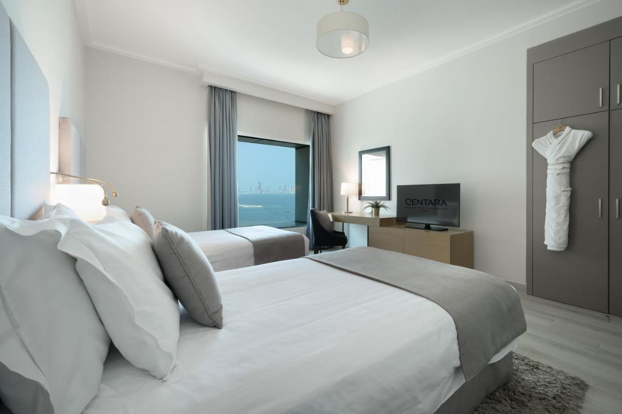Centara West Bay Hotel & Residences Doha Exteriör bild A bedroom at the hotel