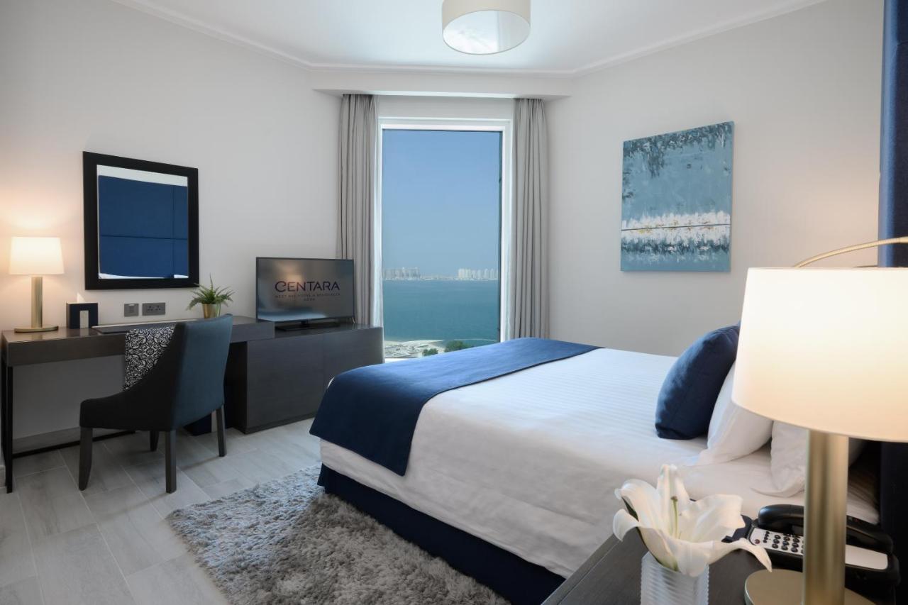 Centara West Bay Hotel & Residences Doha Exteriör bild A bedroom at the Ritz-Carlton, Bahrain