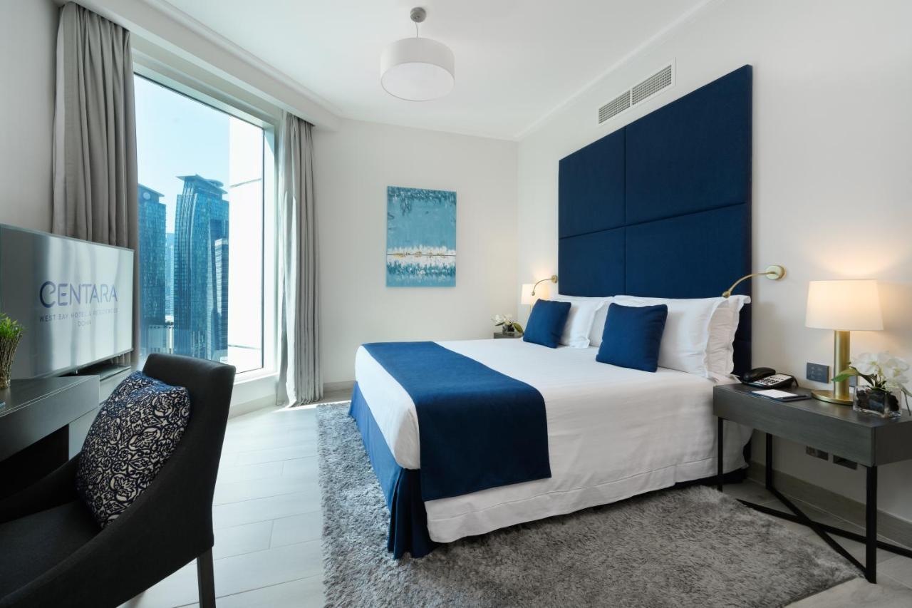 Centara West Bay Hotel & Residences Doha Exteriör bild A bedroom at the Address Downtown Hotel