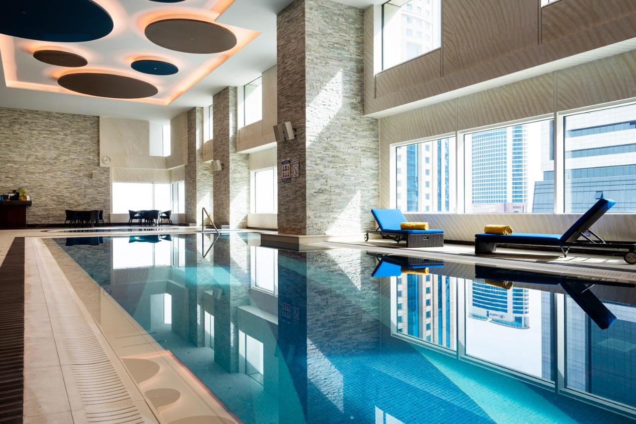 Centara West Bay Hotel & Residences Doha Exteriör bild The pool at the hotel